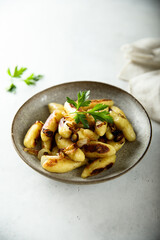 Traditional German potato dumplings with fried onion