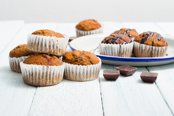 chocolate cupcakes, old white wooden table