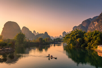 YANGSHUO, CHINA, 6 DECEMBER 2019: Beautiful sunset on the Yulong River in Yangshuo, Guilin, Guangxi