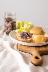 Food photography. Serving option. Salted herring with boiled potatoes and red onions. Dinner.