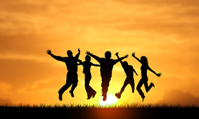 Fototapeta na wymiar Very Happy Young Successful People Silhouettes Jumping Sunset background. Persons Team raised Arms. Success, joy, happiness a nd business Teamwork Concept 