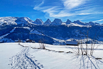 Fototapeta na wymiar Snowy peaks of the Swiss alpine mountain range Churfirsten (Churfürsten or Churfuersten) in the Appenzell Alps massif - Alt St. Johann, Switzerland (Schweiz)