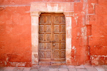Beautiful Antique Wooden Door on the Alley "Calle Toeedo' in Santa Catalina Monastery Conplex, UNESCO World Heritage Site in Arequipa, Peru