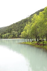 Fototapeta na wymiar Baishui River in Yulong Naxi Autonomous County, Lijiang City, Yunnan Province, also known as Blue Moon Valley