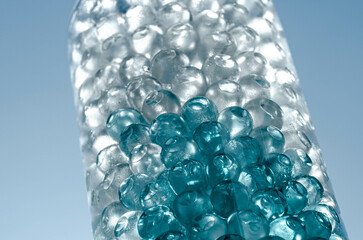 Hydrogel balls in a glass vase. Hydrogel as an art object or background for a computer desktop. Hydrogel close-up.