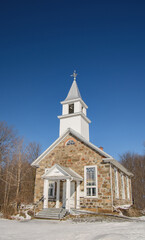 Nice church on the Canadian countryside winter in the province of Quebec