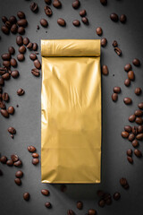 Mock-up golden metallic paper pouch bag on gray background lying at coffee beans with cinnamon
