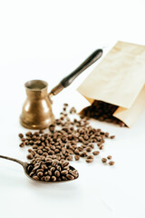 Top view of three different varieties of coffee beans on light white background