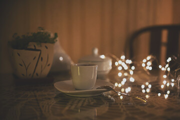 romantic wooden coffee table. Restaurant interior and holiday home decor concept. Toned picture