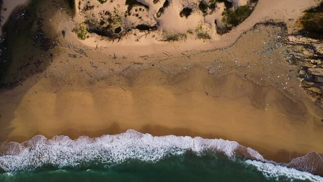 Deserted polluted beach, north of Vinh hy, Vietnam. Aerial static, birdseye
