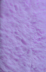 Fabric background with volume and violet color. Vertical shot.
