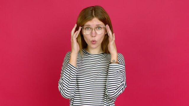 Young woman with glasses and surprised