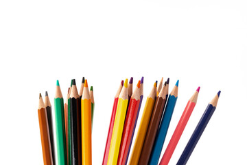 Many multicolored pencils, isolated on white background with copy space. Art and education background.