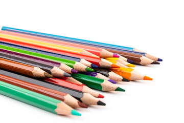 Many multicolored pencils, isolated on white background with copy space. Art and education background.