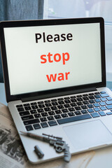 the inscription on the laptop monitor screen "say no to war"