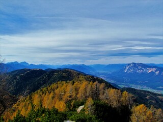 Scenic view of Dobratsch in Geiltal and Geiltal alps in Carinthia region of Austria in autumn taken from Trupijevo Poldne in Karavanke mountains autum colored larch forest covering the slopes