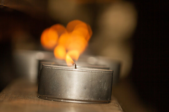 Candle Lit On Wood During Holy Week In Seville