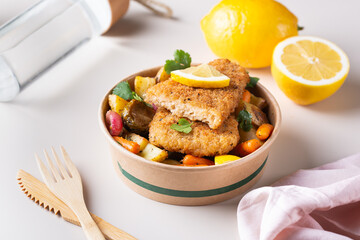 Vegan Plant based fish with crispy batter and roasted vegetables