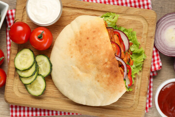Concept of tasty food with pita with chicken meat