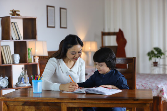 Young Indian Mother Teaching Her School Going Son, Indian Single Mother,  Parenting