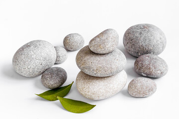 Spa stones for massage with leaves for beauty therapy