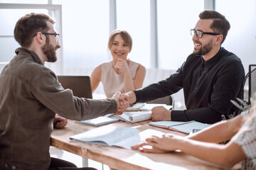 handshake business people at a meeting in the office