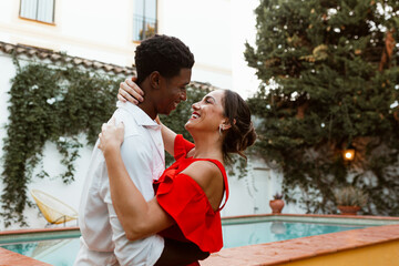 Carefree couple sharing a romantic moment at a holiday resort