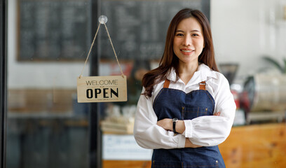 Portrait of Startup successful small business owner in coffee shop.Asian woman barista cafe owner....