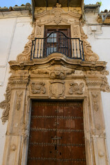 Fototapeta na wymiar Old entrance door at Osuna on Andalusia, Spain