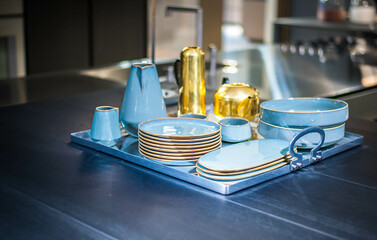 set of blue tableware with golden edging  for a beautifully served family dinner