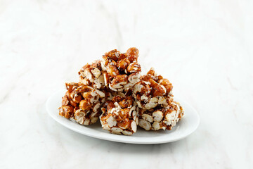 Brondong Jagung or Bororndong, Javanese Traditional Snack Sweet Popcorn with Sticky Palm Sugar.