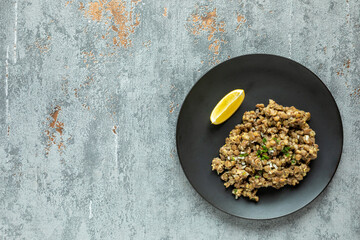 Lentil salad portion plate top view. Ethiopian cuisine. Azifa dish with senafich homemade mustard.