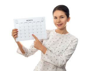 Young woman holding monthly calendar
