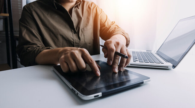 Digital marketing media in virtual screen.business working digital tablet, smartphone with keyboard and computer laptop at office in morning light