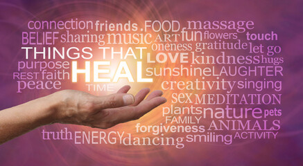 Words associated with THINGS THAT HEAL wall art -  female hand surrounded by a healing words tag cloud on a pink orange rotating spiral of energy ideal for a Healers Therapy Room wall 
 - obrazy, fototapety, plakaty