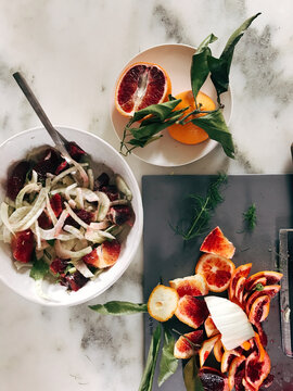 A Top View Of Tasty Winter Fennel Salad With Blood Oranges On Marble Ground