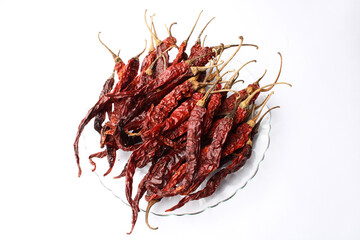 Obraz premium Dried red chillies on a white background