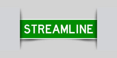 Inserted green color label sticker with word streamline on gray background