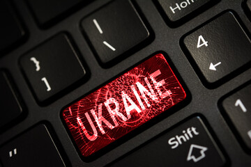 Message on broken red enter key of keyboard. Computer Ukraine war attack warning. Copy space
