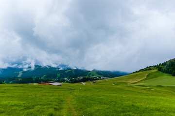 A picturesque landscape view of the French Alps mountains on a cloudy summer day (Valberg, Alpes-Maritimes, France)