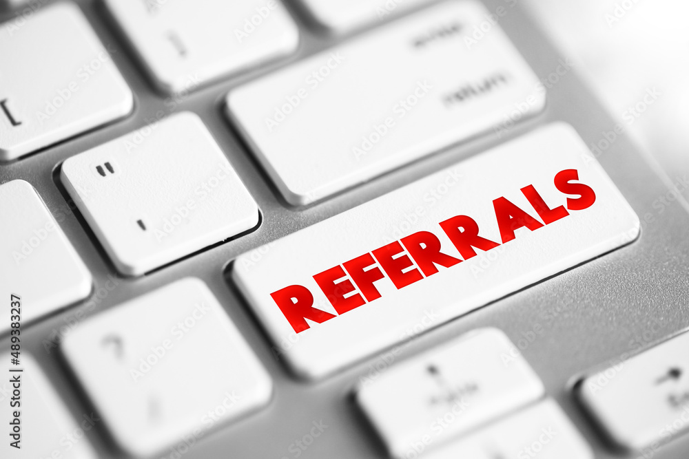 Aufkleber referrals text button on keyboard, concept background