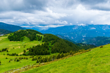 A picturesque landscape view of the French Alps mountains on a cloudy summer day (Valberg, Alpes-Maritimes, France)