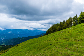 A picturesque landscape view of the French Alps mountains on a cloudy summer day (Valberg, Alpes-Maritimes, France)