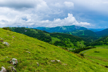 A picturesque landscape view of the French Alps mountains on a cloudy summer day (Valberg, Alpes-Maritimes, France)