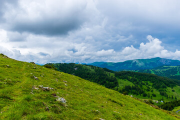 A picturesque landscape view of the French Alps mountains on a cloudy summer day (Valberg, Alpes-Maritimes, France)