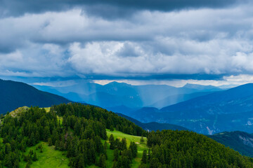 A picturesque landscape view of the French Alps mountains on a cloudy summer day (Valberg, Alpes-Maritimes, France)