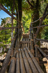 traditional bamboo bridge for crossing river at forest at morning from low angle