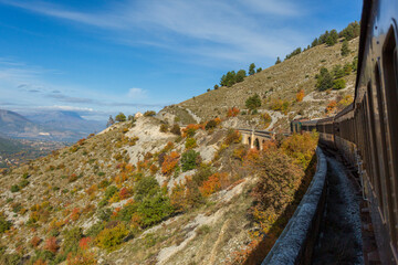 Fototapeta na wymiar Train trip to Abruzzo, the Trans-Siberian of Italy, Journey through mountains and woods in autumn, a beautiful landscape 