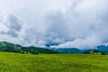 Obraz premium A picturesque landscape view of the French Alps mountains on a cloudy summer day (Valberg, Alpes-Maritimes, France)