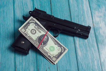 A gun and a pack of dollars